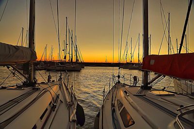 Sailboat in sea at sunset