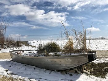 Snow on field against sky during winter