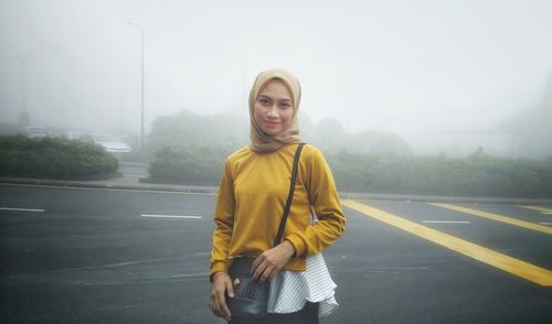 Portrait of man standing on road