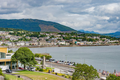 Scenic view of sea and buildings against sky