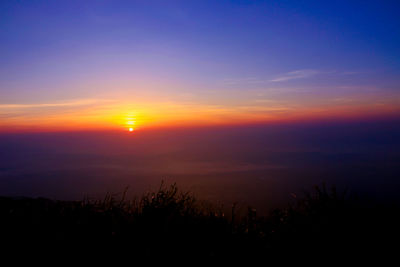 Scenic view of silhouette landscape against romantic sky at sunset