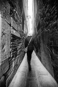 Low section of man and woman walking on road