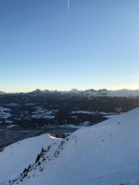 Scenic view of landscape against sky during winter