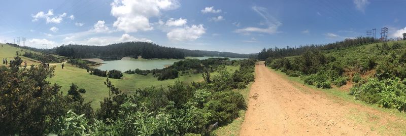 Panoramic view of field against sky