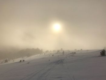 Scenic view of snowy landscape against sky during winter