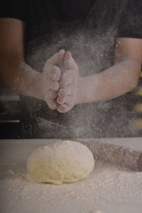 Midsection of person preparing food