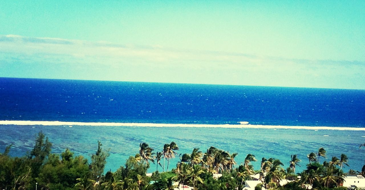 sea, horizon over water, water, blue, scenics, tranquil scene, beauty in nature, tranquility, sky, beach, nature, shore, high angle view, coastline, idyllic, tree, ocean, seascape, outdoors, day