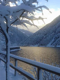 Scenic view of lake with mountains in background