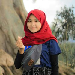 Portrait of smiling girl standing in winter