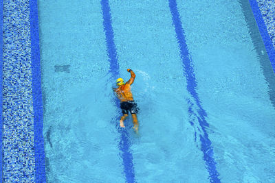 High angle view of man swimming in pool