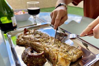 Midsection of person preparing food on table