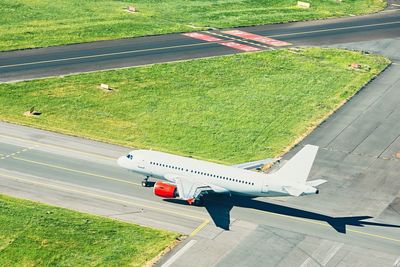 High angle view of airplane on runway