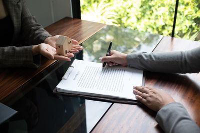 Midsection of businessman working at office