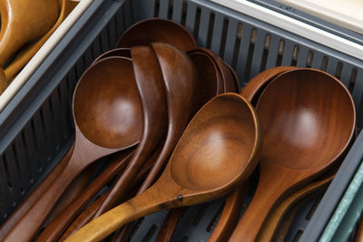 High angle view of wooden spoons on table