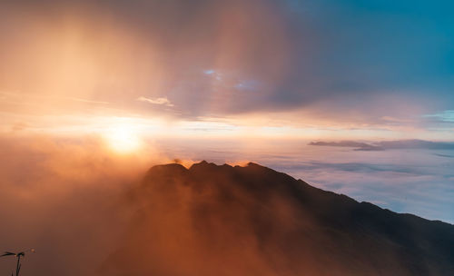 Scenic view of mountains against sky during sunset