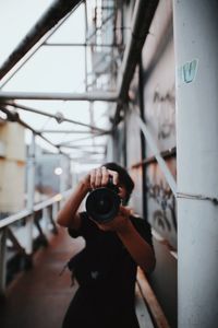 Man photographing camera