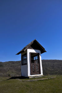 View of landscape against clear blue sky