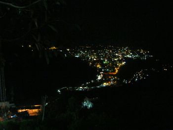 High angle view of illuminated buildings in city at night