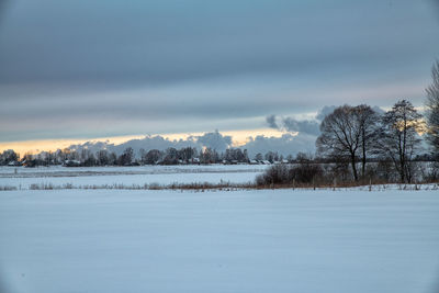 Scenic view of snow covered landscape against sky