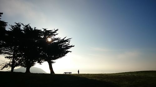Scenic view of field against sky at sunset