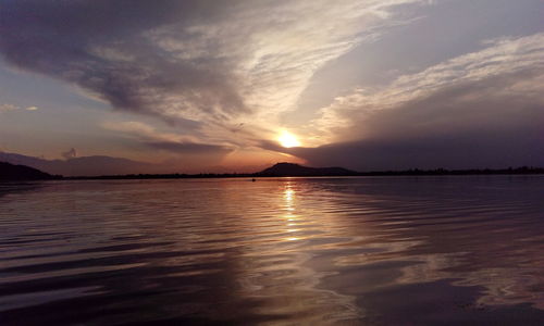 Scenic view of sunset over river