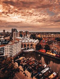 High angle view of illuminated buildings against sky at sunset