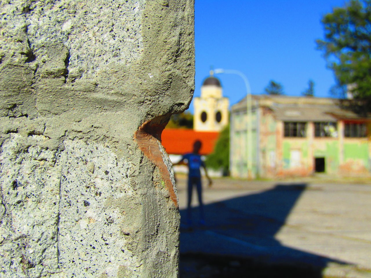 CLOSE-UP OF WEATHERED WALL AGAINST BUILDING