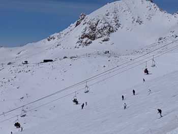 Group of people on snow covered mountain