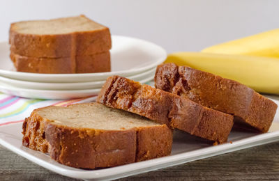 Close-up of bread slices in plate on table