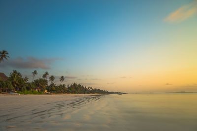 Scenic view of sea against sky at sunset