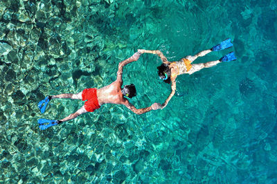 Full frame shot of people in sea