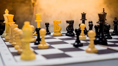 Close-up of chess board on table