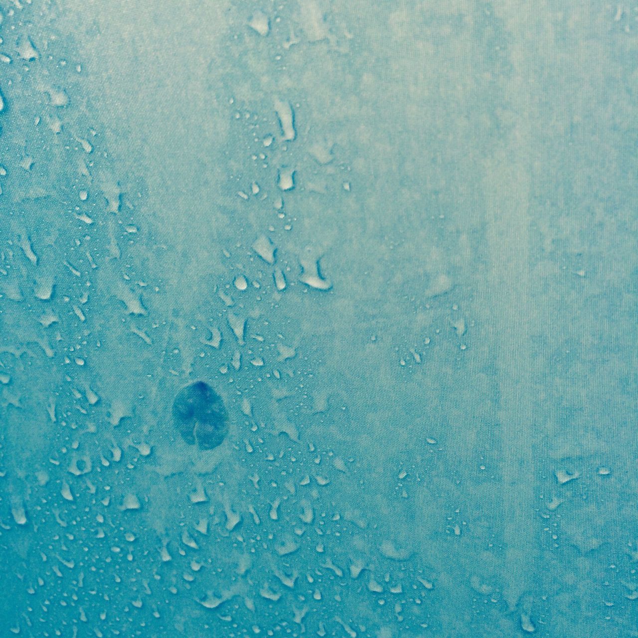 water, drop, full frame, wet, backgrounds, transparent, close-up, glass - material, blue, window, rain, raindrop, indoors, purity, glass, pattern, textured, no people, nature, day