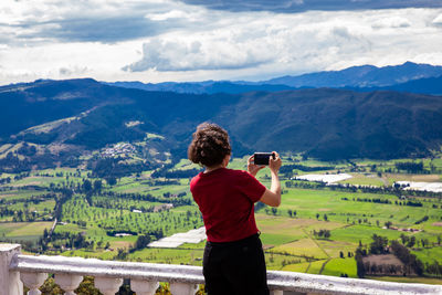 Young woman at a viewpoint over the  sopo valley at the department of cundinamarca in colombia