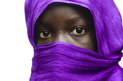 Close-up portrait of purple covering face