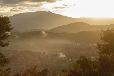 Scenic view of mountains against sky during sunset