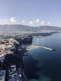 Townscape by sea against sky