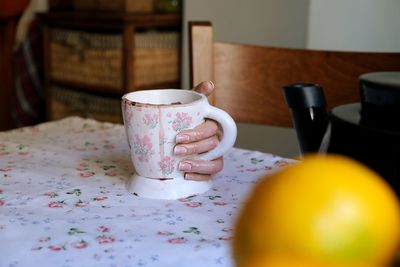 Close-up of coffee cup on table