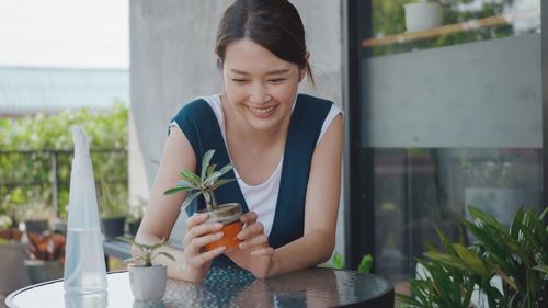 Young woman sitting at restaurant table