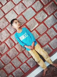 High angle portrait of boy standing outdoors