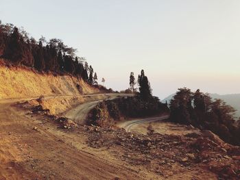 Scenic view of landscape against clear sky during sunset