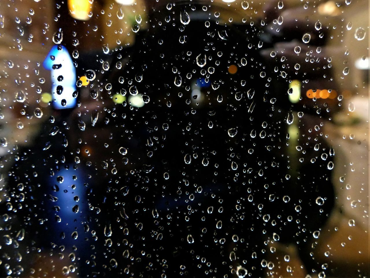 CLOSE-UP OF WET GLASS WINDOW