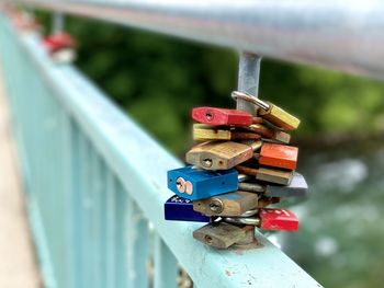 Close-up of padlocks on railing