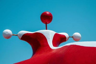 Close-up of balloons against blue sky