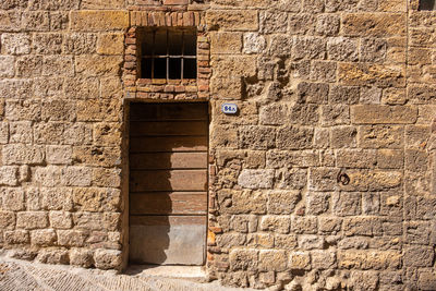 A typical old door on an old waal in little ancient town of colle val d'elsa, tuscany