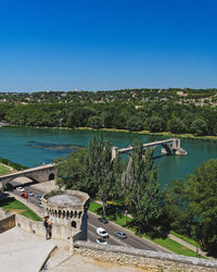 Scenic view of river against clear blue sky