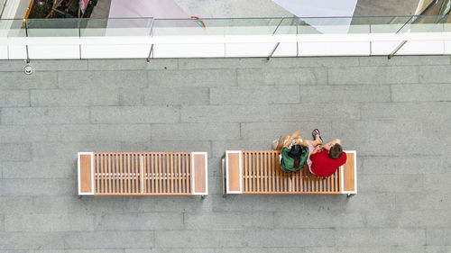 High angle view of people standing against wall