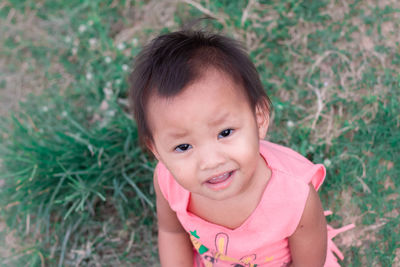 The face of a 2-year-old girl who is confused or strange