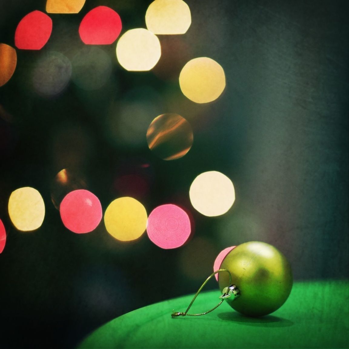 illuminated, multi colored, night, lighting equipment, circle, colorful, decoration, defocused, balloon, green color, sphere, celebration, light - natural phenomenon, low angle view, no people, close-up, hanging, glowing, in a row, indoors