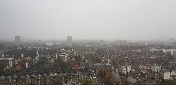 Aerial view of cityscape against clear sky